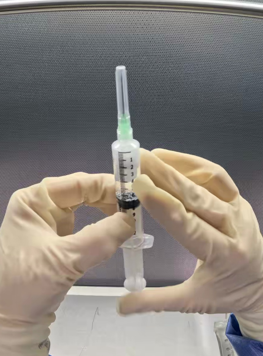 Center Drug-filled syringe