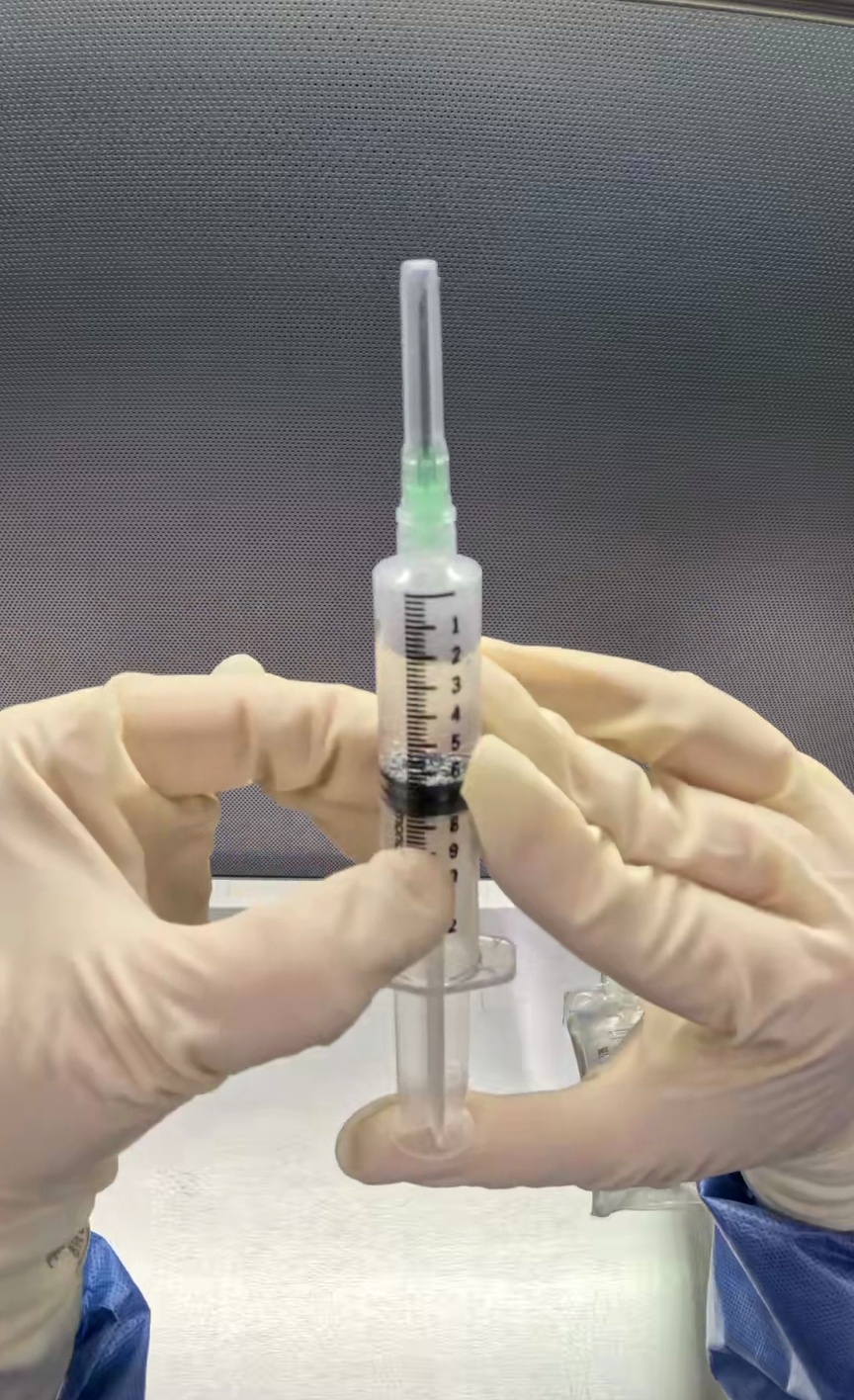 Center Drug-filled syringe
